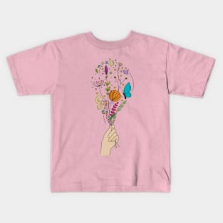 Hand holding beautiful flowers Kids T-Shirt